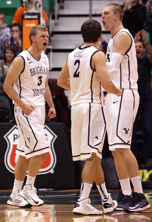 Leah Hogsten  |  The Salt Lake Tribune
Brigham Young Cougars guard Tyler Haws (3), Brigham Young Cougars guard Craig Cusick (2) and Brigham Young Cougars guard Brock Zylstra (13) celebrate a foul on Virginia Tech. 
Brigham Young University defeated Virginia Tech 97-71, Saturday December 29, 2012 in Salt Lake City at Energy Solutions Arena.