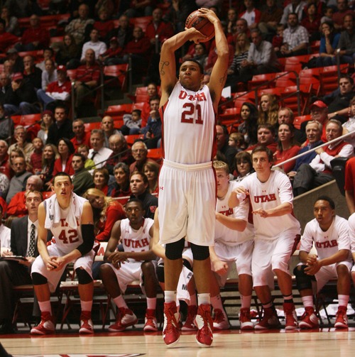 Kim Raff  |  The Salt Lake Tribune
University of Utah player Jordan Loveridge attempts a three point shot against Sacramento State during a men's basketball game at the Huntsman Center in Salt Lake City on November 16, 2012. They went on to lose the game 71-74.