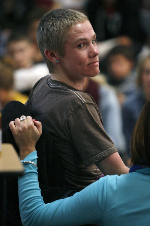 Francisco Kjolseth  |  The Salt Lake Tribune
Jordan High School students pack in for an assembly entitled "Suicide Shouldn't be a Secret!" as Tanner Kirk, 16, a teen who attempted suicide at the age of 13, speaks to them with the help of a voice projecting computer. He survived the attempt and now sits in a wheelchair and can barely talk. Many of the students in attendance have been personally affected by suicide, the second leading cause of death among Utah teens. In 2011, 11,503 Utah teens made a suicide attempt according to the American Foundation for Suicide Prevention.