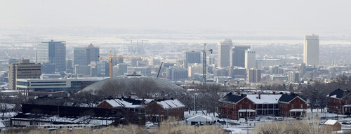 Al Hartmann  |  The Salt Lake Tribune
View of smoggy downtown Salt Lake City as seen from above Fort Douglas on Monday December 31.   A temperature inversion in which cold, polluted air remains trapped in the valley is due to increase in the next few days.