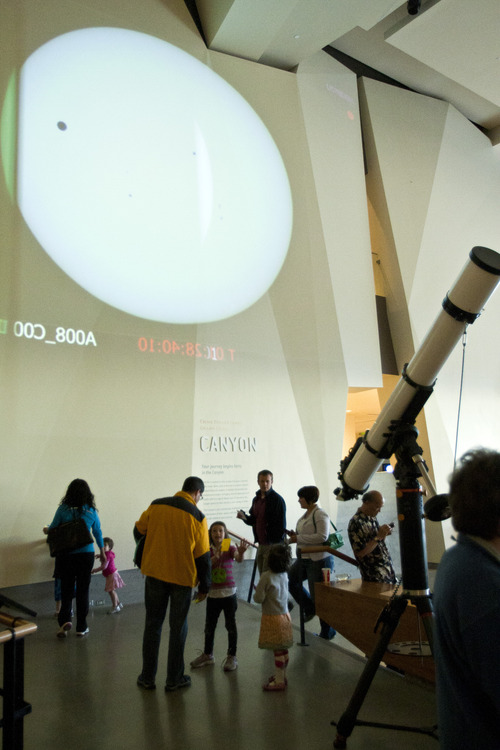 Chris Detrick  |  The Salt Lake Tribune
Visitors watch a projected image of the transit of Venus at the Natural History Museum of Utah Tuesday June 5, 2012. The last time such an event was viewable from Utah was 1882; it won't be seen again from the Beehive State until 2125, decades after even Halley's Comet will have come and gone again.