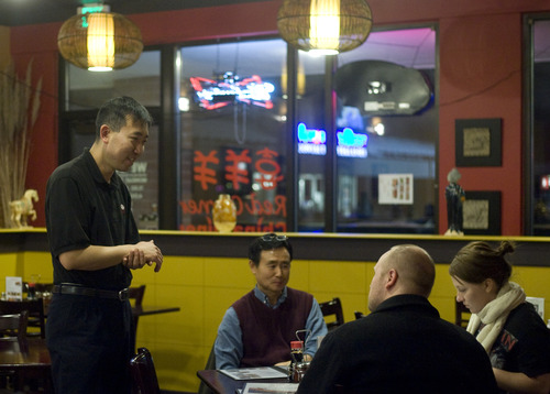 Kim Raff  |  The Salt Lake Tribune
Red Corner China Diner owner Sam Su greets customers in his restaurant in Midvale on Dec. 27, 2012.