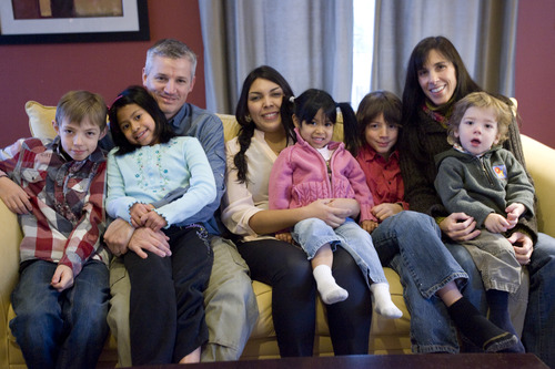 Kim Raff  |  The Salt Lake Tribune
Blanca Alvarez, center, poses for a portrait with the DenBleyker family in their home in South Jordan. Blanca Alvarez, is a live-in au pair from El Salvador who helps Jeffrey and Jennifer DenBleyker take care of their five children.
