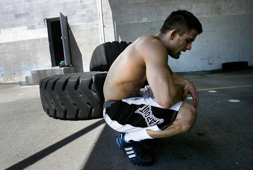 Scott Sommerdorf  |  The Salt Lake Tribune
MMA fighter Rad Martinez takes a breather after pushing a weighted "Prowler" sled 40 yards, 15 times across the back parking lot at the Riven Academy in Orem, Thursday, Aug. 11, 2011. Martinez will fight Feb. 21 in West Valley City in the Bellator MMA Featherweight Tournament Finals.