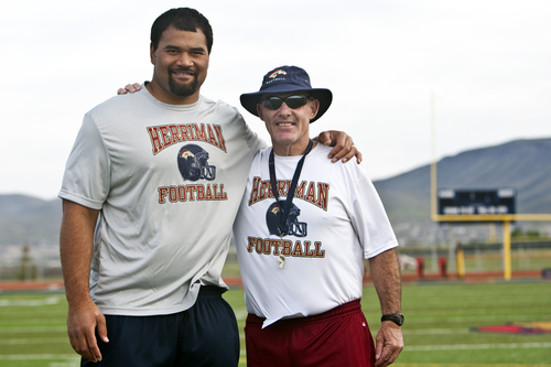 Photo by Chris Detrick | The Salt Lake Tribune 
Haloti Ngata and coach Larry Wilson pose for a portrait during a football camp at Herriman High School Tuesday May 31, 2011.