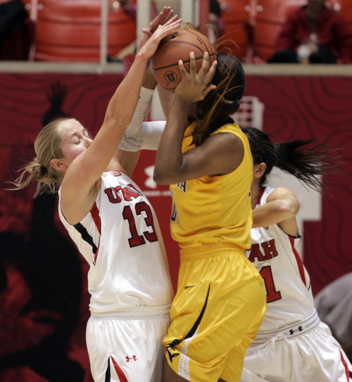 Kim Raff | The Salt Lake Tribune
University of Utah player Rachel Messer defends as California player Reshanda Grey drives the basket during a game at the Huntsman Center in Salt Lake City on January 4, 2013.