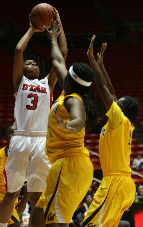 Kim Raff | The Salt Lake Tribune
(left) University of Utah player Iwalani Rodrigues attempts a field goal as California players (middle) Talia Caldwell and (right) Eliza Pierre defend during a game at the Huntsman Center in Salt Lake City on January 4, 2013.