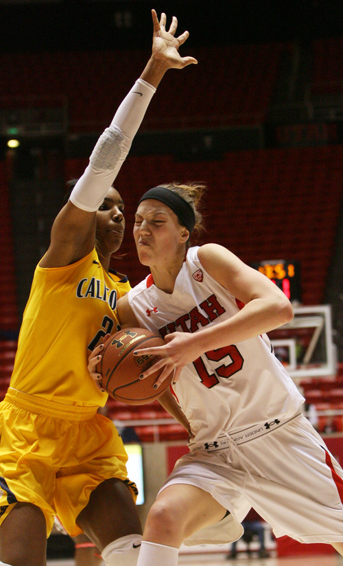 Kim Raff | The Salt Lake Tribune
(right) University of Utah player Michelle Plouffe drives the basket as California player Reshanda Grey defends during a game at the Huntsman Center in Salt Lake City on January 4, 2013.