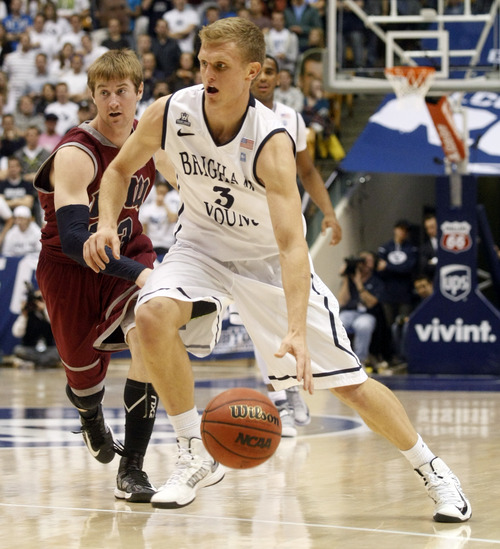 Chris Detrick  |  The Salt Lake Tribune
Brigham Young Cougars guard Tyler Haws (3) runs around Loyola Marymount Lions guard Chase Flint (23) during the second half of the game at  Thursday January 3, 2013.