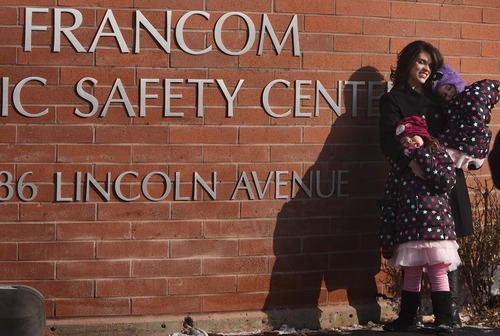 Leah Hogsten  |  The Salt Lake Tribune
Jared Francom's wife, Erin Francom, and their daughters Samantha, 6, and Hailey, 4, attended a ceremony on Friday to rename the Ogden Public Safety Building to the Francom Public Safety Center in honor of Jared Francom, who was killed one year ago in the line of duty. The renaming ceremony recognized Francom and other officers injured in the shooting.