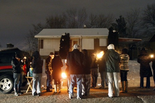 Chris Detrick  |  The Salt Lake Tribune
Family and friends of Matthew Stewart participate in "a candlelight time of silence for peace," across from Stewart's home in Ogden Friday January 4, 2013.