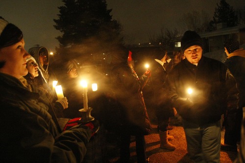 Chris Detrick  |  The Salt Lake Tribune
Family and friends of Matthew Stewart participate in "a candlelight time of silence for peace," across from Stewart's home in Ogden Friday January 4, 2013.