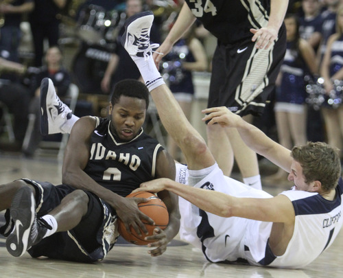 Rick Egan  | The Salt Lake Tribune 

Utah State Aggies forward Ben Clifford (1)tries to get the ball from Idaho Vandals guard Connor Hill (5),  in basketball action Utah State vs. The Idaho Vandals,  in Logan, Saturday, January 5, 2013.