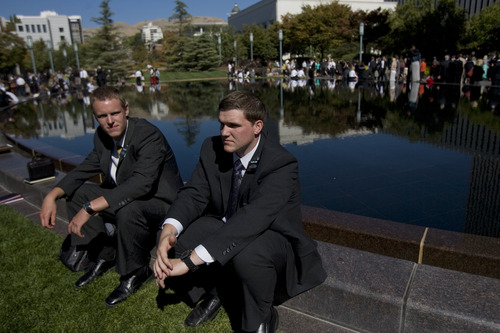 Kim Raff | The Salt Lake Tribune
LDS missionaries Elders Tyler McCord, left, and Devin Duke sit by the reflecting pool at Temple Square during the 183rd General Conference of the LDS Church in Salt Lake City, Utah, on Oct. 7, 2012. The day before, church President Thomas S. Monson had announced lower age limits for Mormon missionaries -- 18 (down from 19) for men and 19 (down from 21) for women.