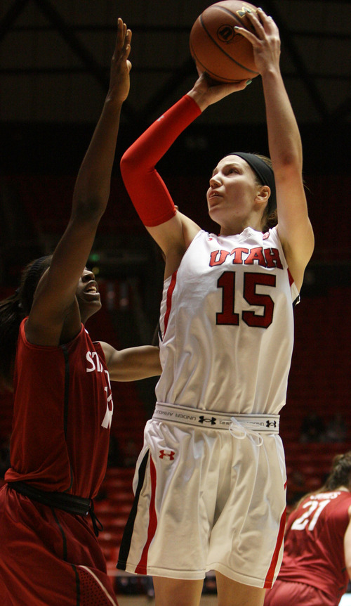 Kim Raff | The Salt Lake Tribune
(right) University of Utah player Michelle Plouffe attempts a shot as Stanford player (left) Chiney Ogwumike defends during a game at the Huntsman Center in Salt Lake City on January 6, 2013. Stanford went on to win the game 70-56.