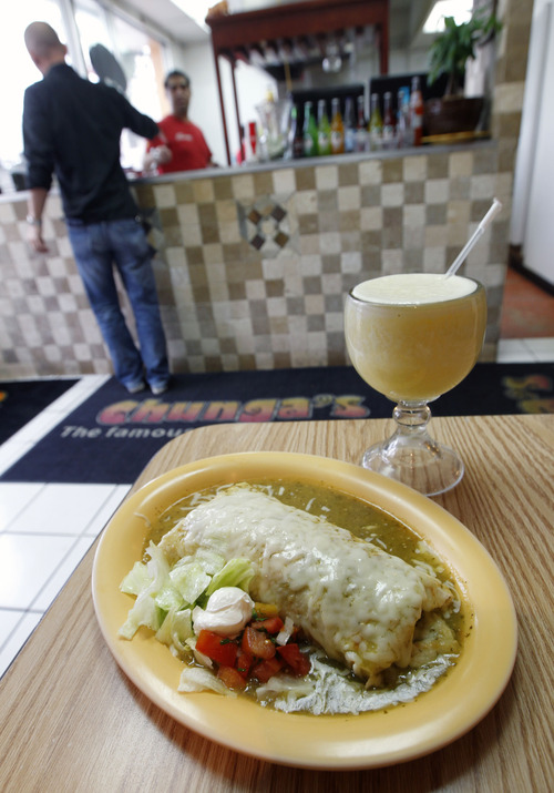 Al Hartmann  |  The Salt Lake Tribune
Chunga's al pastor, (pork and pineapple) burrito smothered with sauce and cheese.