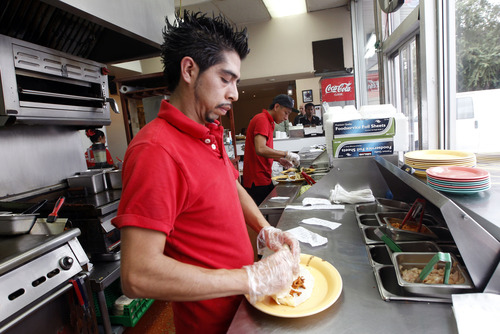 Al Hartmann  |  The Salt Lake Tribune
Chefs work quickly turning out the food during lunch hour at Chunga's Mexican Grill at 180 S. 900 West in Salt Lake City.