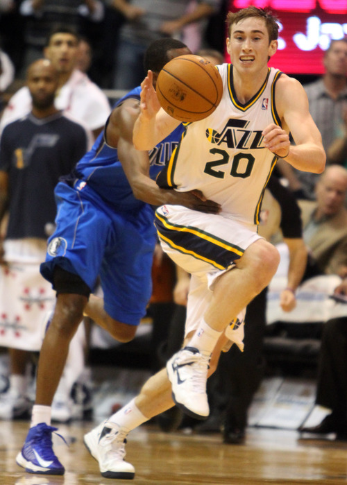 Rick Egan  | The Salt Lake Tribune 

Utah Jazz shooting guard Gordon Hayward (20) is fouled by Dallas Mavericks point guard Darren Collison (4) as he brings the ball down court for, in NBA action, at EnergySolutions Arena, Monday, January 7, 2013.
