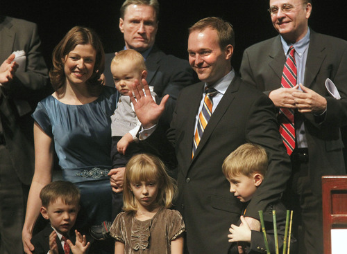 Al Hartmann  |  The Salt Lake Tribune
New Salt Lake County Mayor Ben McAdams with his family waves to audience Monday at the Rose Wagner Theatre, where he took the oath of office.  Monday January 7 after taking the oath of office.