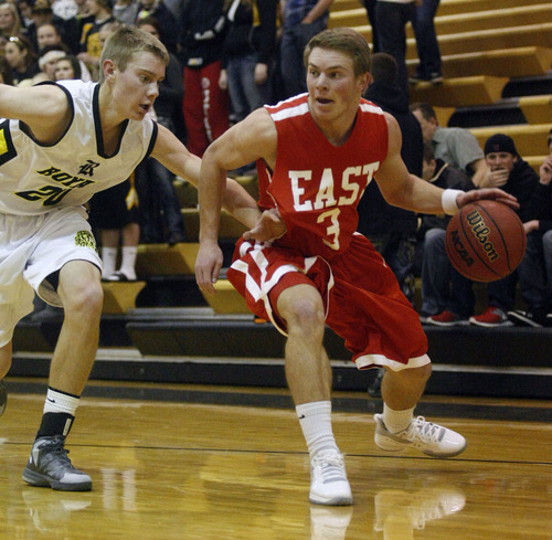 Chris Detrick  |  The Salt Lake Tribune
East's Preston Curtis (3) is guarded by Roy's David Hadley (20) during the game at Roy High School Friday January 4, 2013.