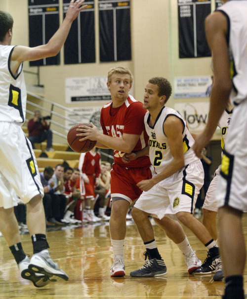 Chris Detrick  |  The Salt Lake Tribune
East's Connor Pardoe (22) is guarded by Roy's Daimon Alexander (2) during the game at Roy High School Friday January 4, 2013.