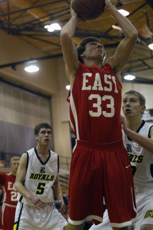 Chris Detrick  |  The Salt Lake Tribune
East's Mitch Grant shoots past Roy's David Hadley during the game at Roy High School.