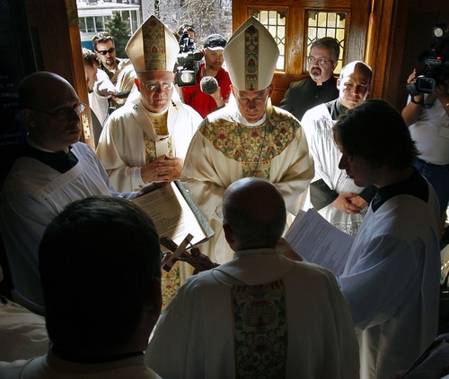 Bishop John C. Wester (center facing) is joined by Archbishop George Niederauer (left) as they are greeted at the front door of the Cathedral of the Madeleine by Monsignor J. Terrence Fitzgerald during Wester's installation as bishop at the Cathedral of the Madeleine in Salt Lake City on March 14, 2007.  Steve Griffin/The Salt Lake Tribune