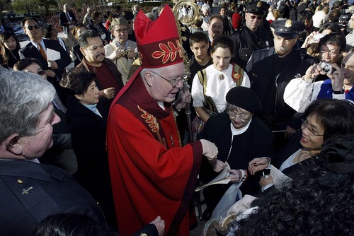 Archbishop George H. Niederauer greets supporters outside St Mary's Cathedral after he is sworn in as the new archbishop of San Francisco on February 15, 2006. (Photo by David Paul Morris/The Salt Lake Tribune)