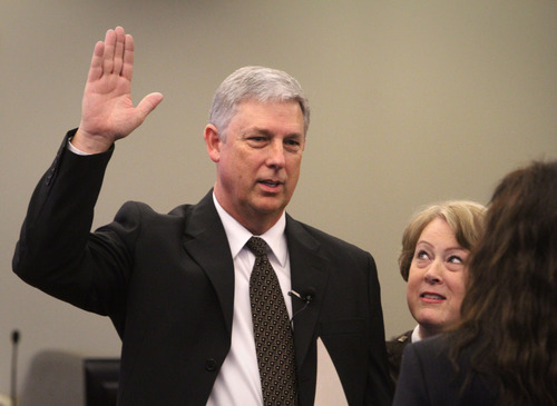 Rick Egan  |  The Salt Lake Tribune
Jerry Rechtenbach stands by his wife, Teresa, as he is sworn in on Thursday as the new Taylorsville mayor by City Recorder Cheryl Peacock Cottle.