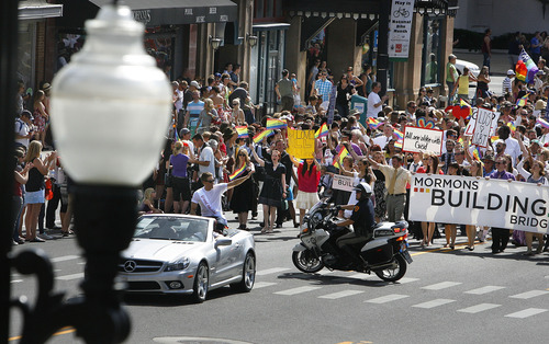 Scott Sommerdorf  |  The Salt Lake Tribune             
Grand Marshal Dustin Lance Black leads the annual Gay Pride Parade through downtown Salt Lake City followed by the Mormons Building Bridges group right behind, Sunday, June 3, 2012.