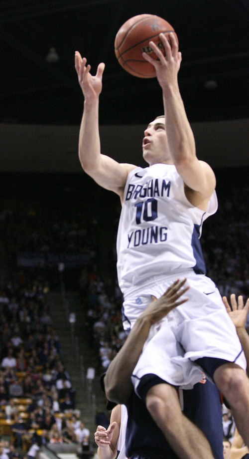 Paul Fraughton  |   Salt Lake Tribune
BYU's Matt Carlino  is fouled as he goes to the hoop .BYU played The Pepperdine Waves at BYU's Marriott Center.
 Thursday, January 10, 2013