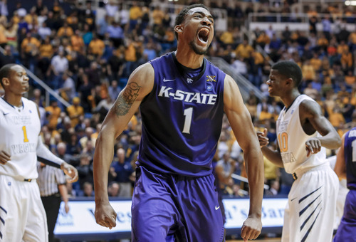 Kansas State's Shane Southwell (1) reacts after blocking a West Virginia shot in the final second of an NCAA college basketball game at WVU Coliseum in Morgantown, W.Va., on Saturday, Jan. 12, 2013. Kansas State defeated West Virginia 65-64. (AP Photo/David Smith)