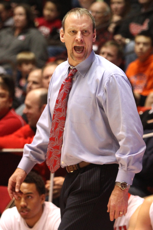 Rick Egan  | The Salt Lake Tribune 

Utes head coach, Larry Krystowiak reacts after being slapped with a technical foul, in basketball action Utah vs. USC, at  the Huntsman Center, Saturday, January 12, 2013.