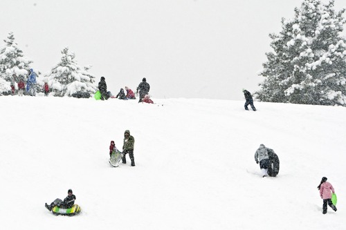 Chris Detrick  |  The Salt Lake Tribune
People sled down a hill at Sugar House Park Friday January 11, 2013.