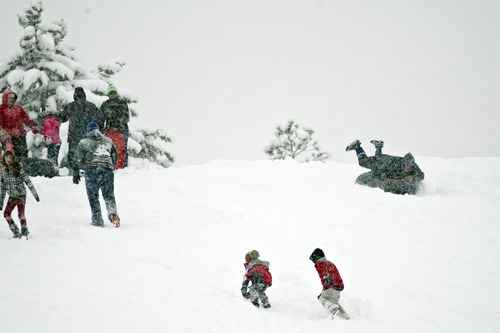 Chris Detrick  |  The Salt Lake Tribune
People sled down a hill at Sugar House Park Friday January 11, 2013.