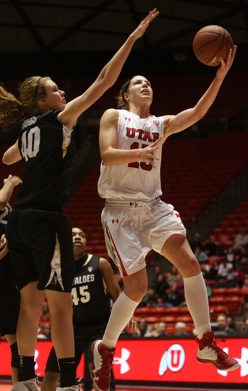 Kim Raff | The Salt Lake Tribune
University of Utah player (right) Michelle Plouffe attempts a layup as Colorado player Rachel Hargis defends during a game at the Huntsman Center in Salt Lake City on January 13, 2013. Utah lost the game 43-56.