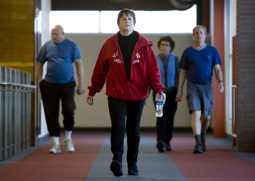 Kim Raff  |  The Salt Lake Tribune
Catherine Barnhart walks on the indoor track at the Millcreek Recreation Center in Salt Lake City on January 4, 2013. Barnhart is a 15-year patient of Beth Hanlon, a doctor with MDVIP, a concierge model where patients pay an upfront retainer for the privilege of having round-the-clock access. Under Hanlon's coaching Barnhart has lost 35 pounds in a year.