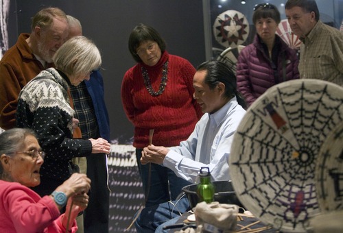 Kim Raff  |  The Salt Lake Tribune
Navajo artists Mary Holiday Black, left, and Anderson Black weave sumac branches for visitors during a basket weaving demostration at "A Celebration of Contemporary Navajo Baskets" exhibit, which opened at the Natural History Museum of Utah in Salt Lake City on January 12, 2013. The exhibit features more than 150 works of art created by the basket weavers of Monument Valley, Utah. Black is considered the matriarch of the Navajo basket revolution.
