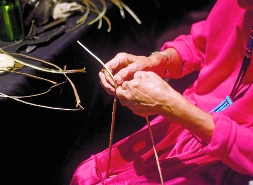 Kim Raff  |  The Salt Lake Tribune
Navajo artist Mary Holiday Black works with sumac branches used for weaving during a basket weaving demostration at "A Celebration of Contemporary Navajo Baskets" exhibit, which opened at the Natural History Museum of Utah in Salt Lake City on January 12, 2013. The exhibit features more than 150 works of art created by the basket weavers of Monument Valley, Utah. Black is considered the matriarch of the Navajo basket revolution.