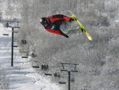 Scott Sommerdorf   |  The Salt Lake Tribune
Max Raymer of Park City jumps during the Open Division of the Recon Tour Snowboard competition at Park City Mountain Resort, Sunday, January 13, 2013.
