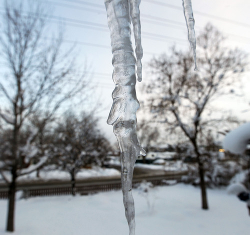 Al Hartmann  |  The Salt Lake Tribune
An icicle clings to a roof in Salt Lake as the sun rises Monday,  Jan. 14, to the coldest morning of the year. It was about zero degrees.