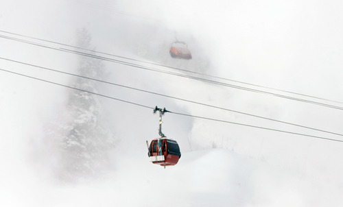Steve Griffin | The Salt Lake Tribune

Skiers brave sub-zero temperatures as a gondola passes through clouds of man-made snow at the Canyons Resort in Park City on  Monday January 14, 2013.