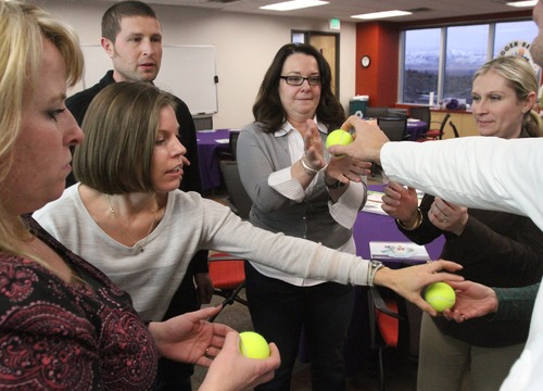 Rick Egan  | The Salt Lake Tribune 
CHG employees do a team-building exercise, at their office in Salt Lake Thursday. CHG rose from 27th last year to 9th in Fortune's 2012 list of top 100 businesses to work for.