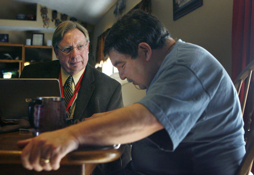 Steve Griffin  |  The Salt Lake Tribune
Hospice chaplain Peter Nackowski, left, listens to Tony Velasquez during a visit at Tony's Syracuse, Utah home Wednesday, Feb. 24, 2010.  Velasquez, a Navy veteran and submarine mechanic, died at age 60 on Dec. 11, 2012, more than six years after he was diagnosed with a degenerative disease.