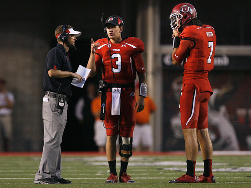Scott Sommerdorf  |  The Salt Lake Tribune             
Utah receivers coach and passing game coordinator Aaron Roderick will reportedly join BYU's staff. Roderick, a former BYU receiver, is pictured here with Utah quarterbacks Jordan Wynn, center, and Travis Wilson during a 2012 game against Northern Colorado.