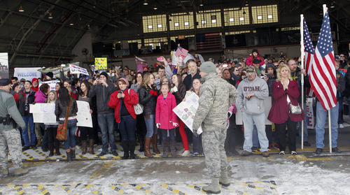 Al Hartmann  |  The Salt Lake Tribune
Friends and family members of the 1st Battalion, 211th Aviation wait inside Utah Air National Guard Base hangar Thursday for the soldiers' return from their 12-month deployment to Afghanistan.