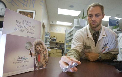 Paul Fraughton  |  The Salt Lake Tribune
Pharmacy manager at Harmon's City Creek store, Jameson Rice, holds the intradermal flu vaccine that is now available at 10 Harmon's pharmacies.
 Wednesday, January 16, 2013