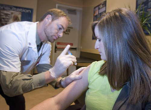 Paul Fraughton  |  The Salt Lake Tribune
Pharmacy manager at Harmon's City Creek store, Jameson Rice, gives Lisa Stapley a flu shot using the intradermal vaccine that is now available at 10 Harmon's pharmacies.
 Wednesday, January 16, 2013