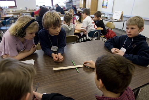 Kim Raff | The Salt Lake Tribune 
Children in a third grade science lab conduct an experiment to learn about levers at Indian Hills Elementary in Salt Lake City on January 14, 2013. The school earned a science grant for its hands-on learning lab.