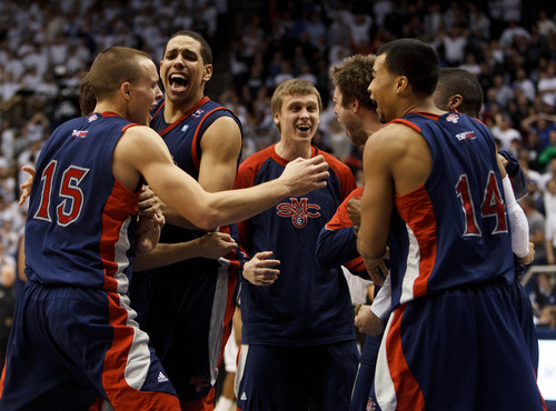 Trent Nelson  |  The Salt Lake Tribune
Saint Mary's players celebrate after Saint Mary's guard Matthew Dellavedova (4) hit a last-second shot to win the game. BYU hosts Saint Mary's, college basketball Wednesday January 16, 2013 in Provo.